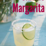 Pinterest Pin with text overlay 'Classic Margarita', image of salt rimmed glass with margarita garnished with a lime wheel.